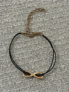 Y2K theme gold tone infinity symbol on 2-stranded black cord adjustable bracelet